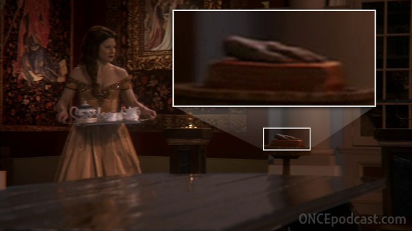 Belle serving Rumplestiltskin with hand on pedestal (Skin Deep-1x12)
