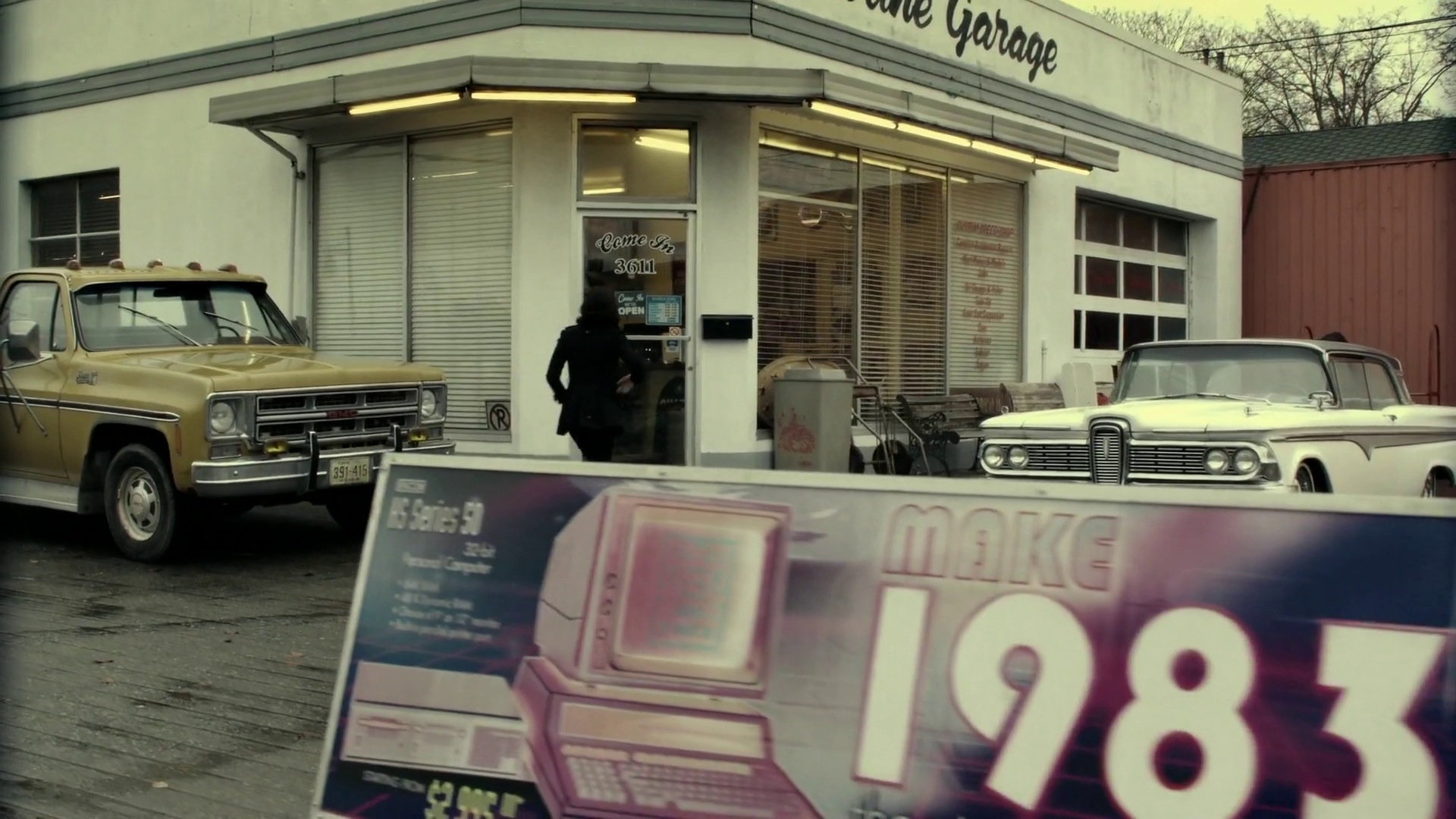 1983 sign outside Billy's shop (2x17 Welcome to ...