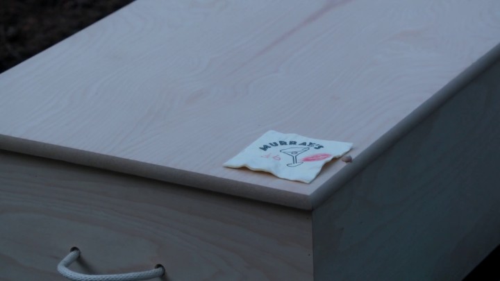 Once Upon a Time 4x20 Lily - Isaac leaves Murray's club napkin on Cruella's coffin