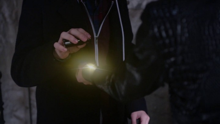 Henry uses squid ink on Emma's cuff